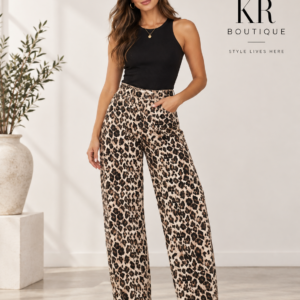 Woman wearing leopard wide-leg jeans with black sleeveless top