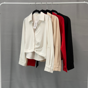 Long sleeve high-low hem collar blouse displayed on hangers in several colors